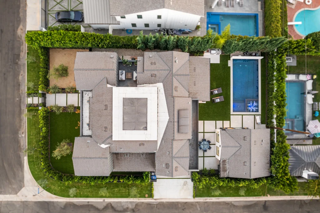 aerial-view-of-modern-suburban-house-with-pool-2025-02-10-06-47-06-utc